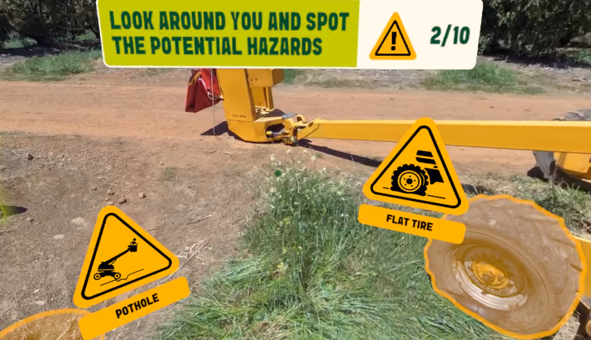 VR hazard identification exercise flagging a pothole and a flat tire in work area.