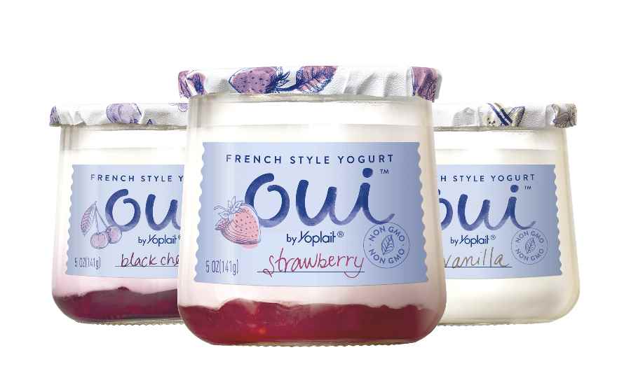 Three glass jars filled with cream colored yogurt stand in a triangle. The front jar has strawberry at the bottom, while the one to the left has black cherry. The labels on the jars read: French Style Yogurt. Oui by Yoplait. The flavor reads: Strawberry (front jar), black cherry (left jar), and vanilla (right jar). Yoplait did a great job listening to their audience and making them feel proud of their brand.