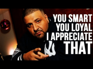 DJ Khaled is pointing at the camera. He is wearing a New York Yankees shirt. To his left are the words: You smart. You loyal. I appreciate that."