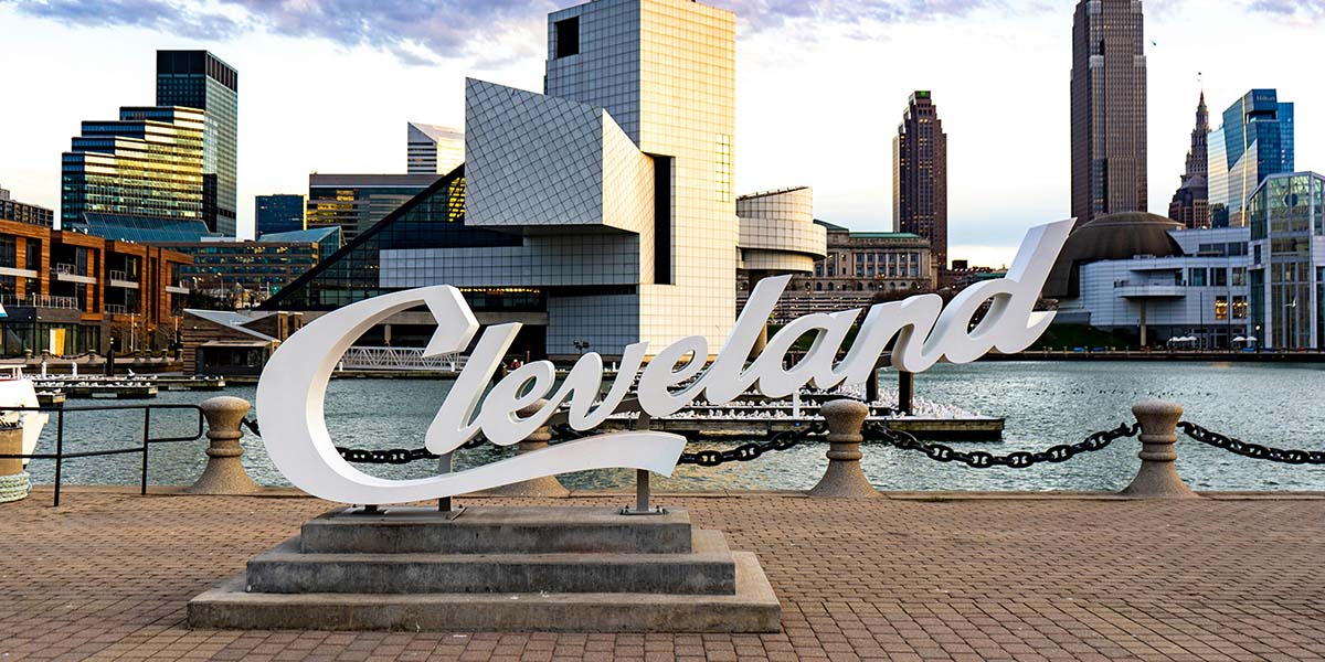 Image of Cleveland sign by waterfront. Photo by DJ Johnson from Unsplash.