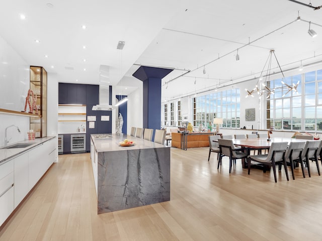 Loft kitchen with marble waterfall island at Sky Lofts, 145 Hudson Street, in Tribeca, Manhattan, by Gallery KBNY