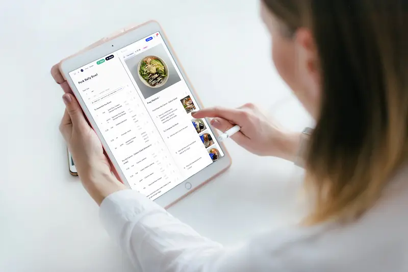 Chef stirring a pan and a chart showing invoice cost categories