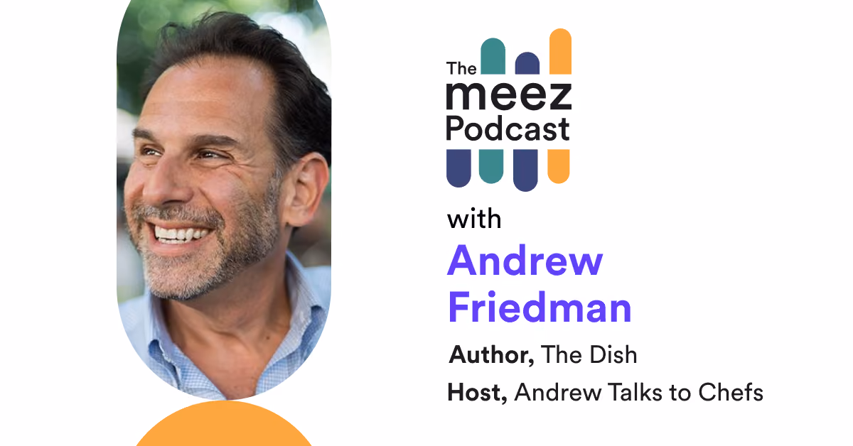 Rectangle with white background and a photo of Andrew Friedman