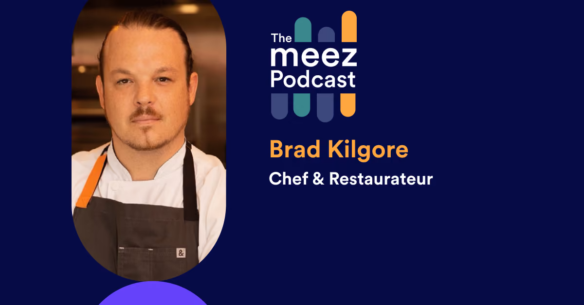Rectangle image with navy background of Brad Kilgore