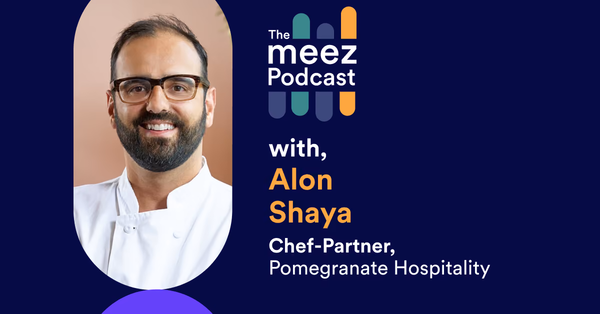 rectangle image with navy background of Alon Shaya
