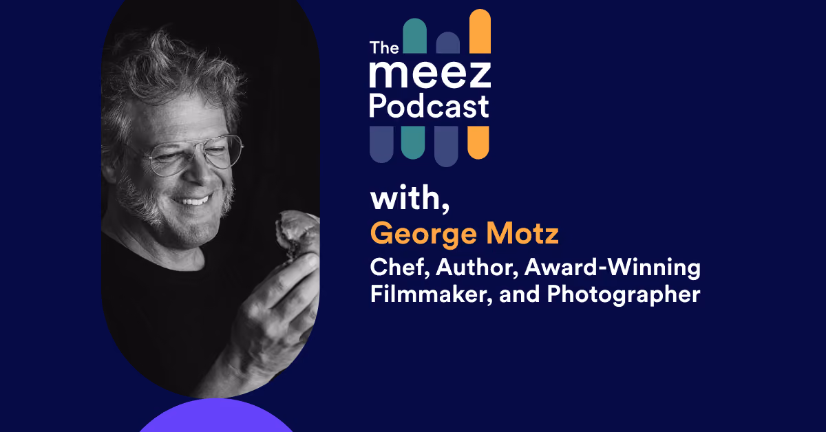Rectangle Image with navy background of George Motz 