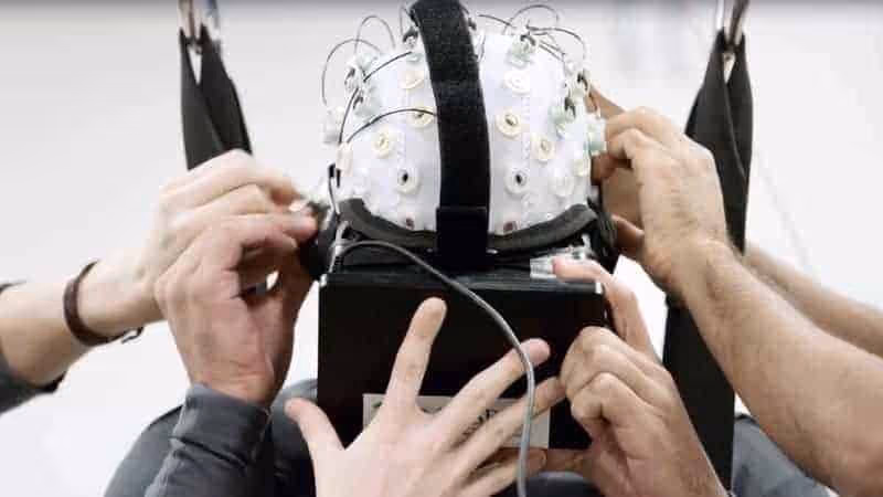hands holding a device with wires