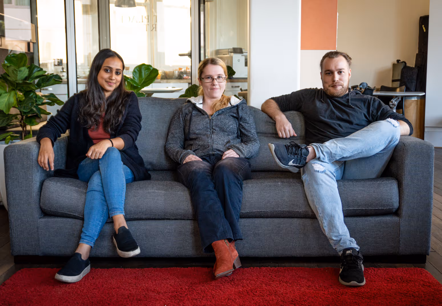 a group of people sitting on a couch