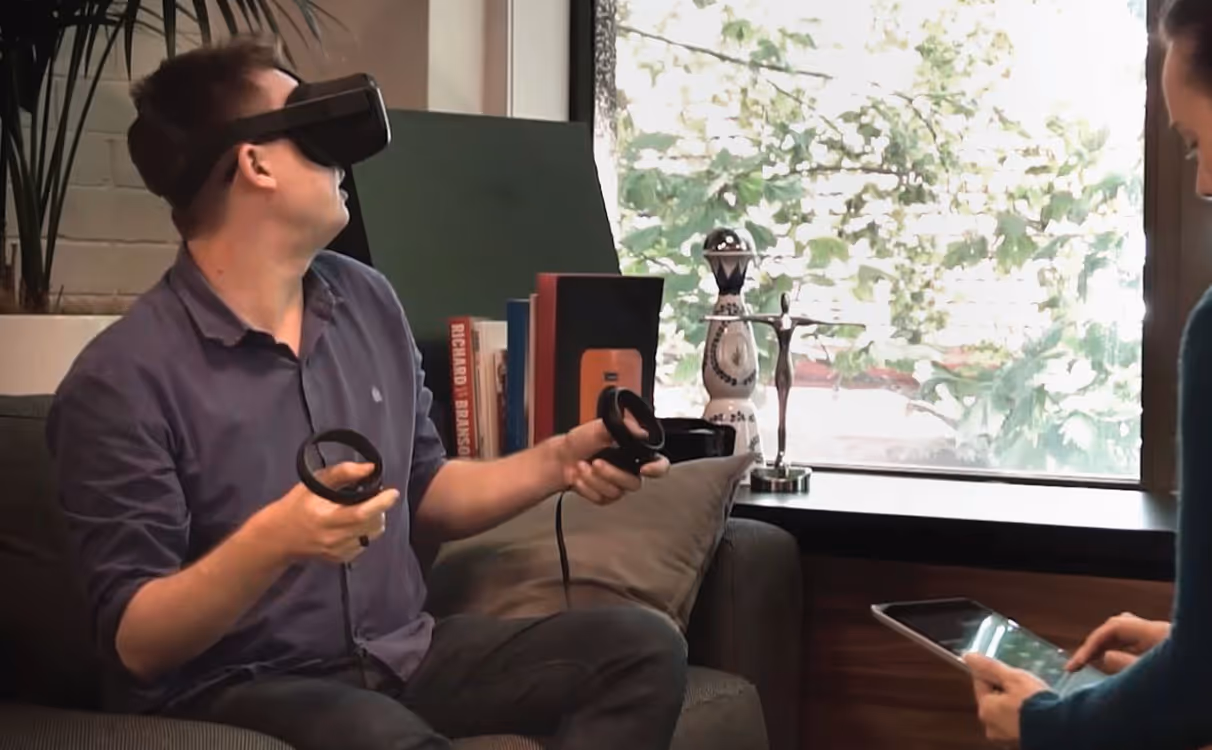 a man wearing virtual reality goggles