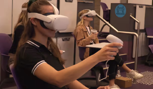 a woman wearing virtual reality goggles