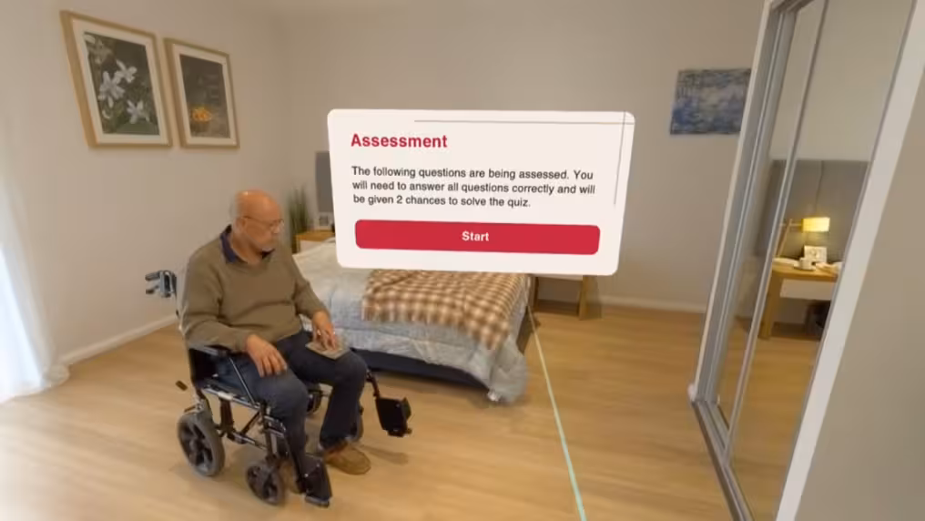 VR training scenario showing an elderly man in a wheelchair in a bedroom, with an on-screen 'Assessment' prompt explaining that questions will be assessed with two chances to solve the quiz, and a Start button.