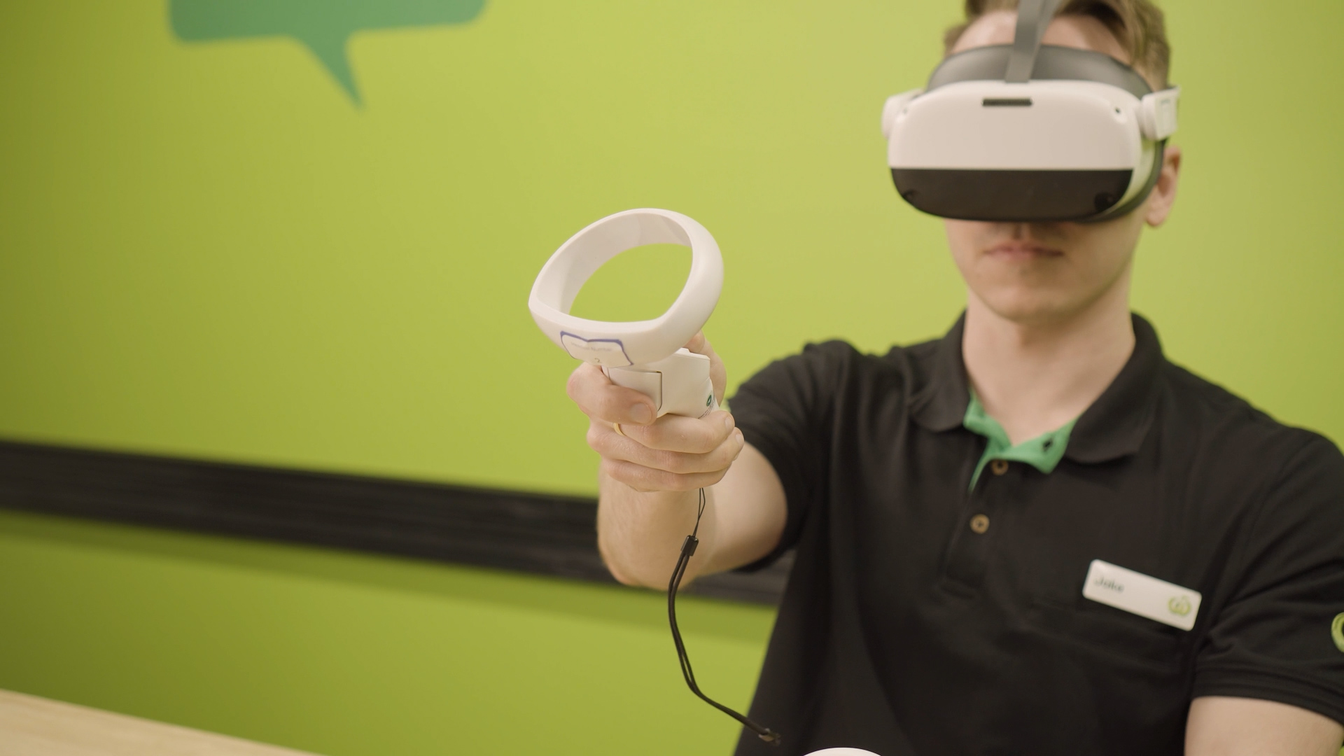 Employee wearing a VR headset during frontline training as part of Woolworths' national VR training program