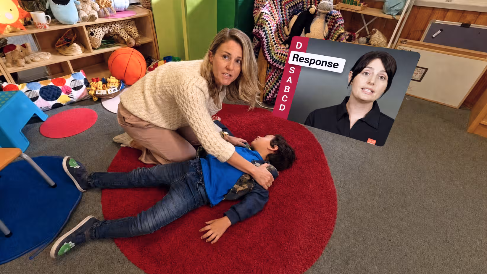 VR training scenario of DRSABCD first aid training showing a woman checks a child's response while a video guide walks through the Response step.