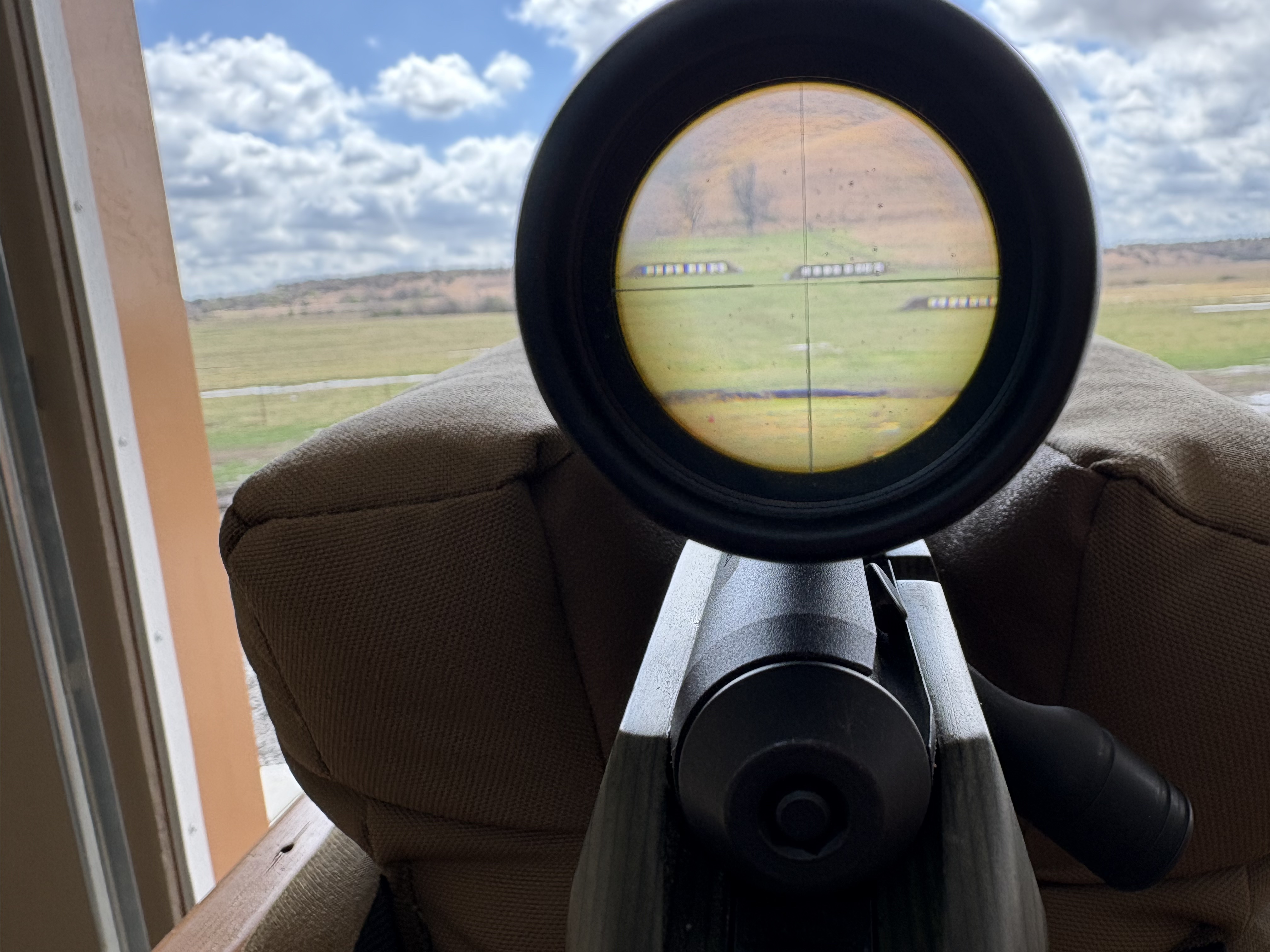 View through the Zeiss V3 reticle showing steel silhouette targets positioned across an Oklahoma hillside at distance
