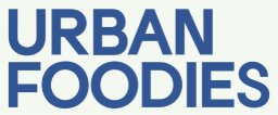Text logo reading Urban Foodies in bold uppercase blue letters on white background.