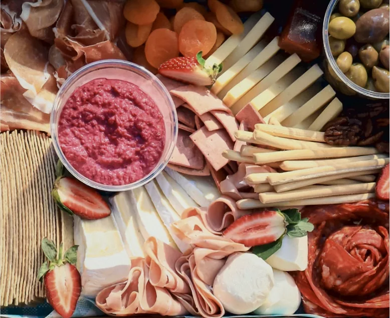Grazing board with cured meats, cheese and beetroot dip