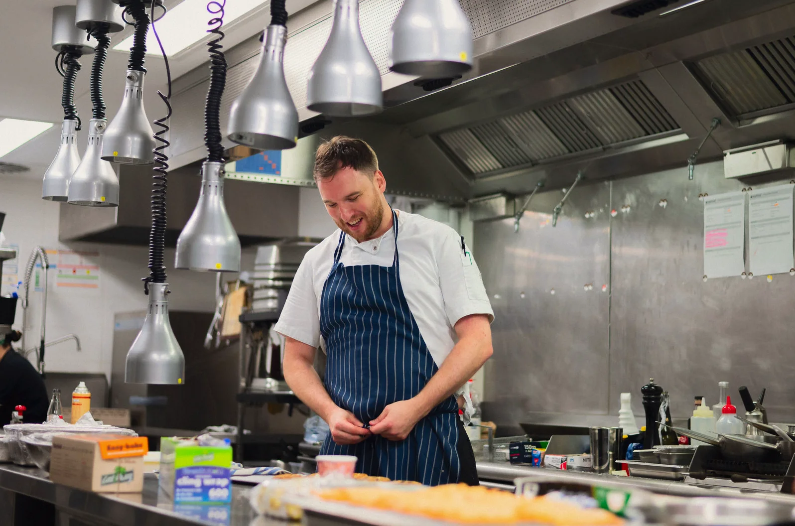 EatFirst chef in an onsite commercial kitchen