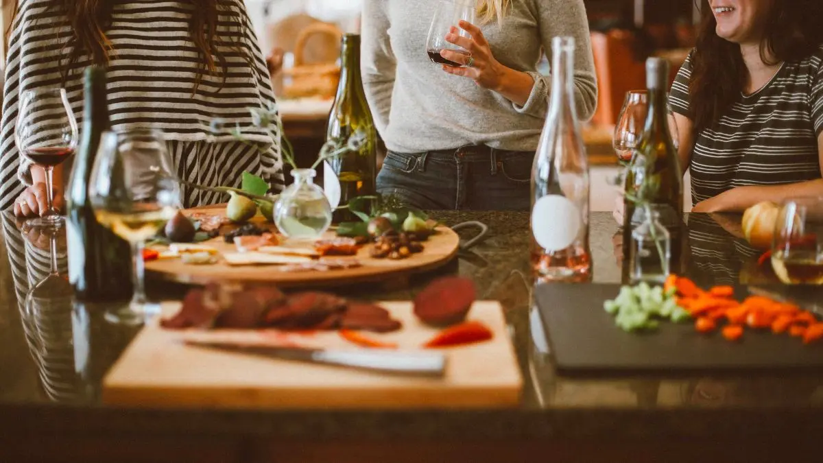 Women enjoying wine and a grazing platter.