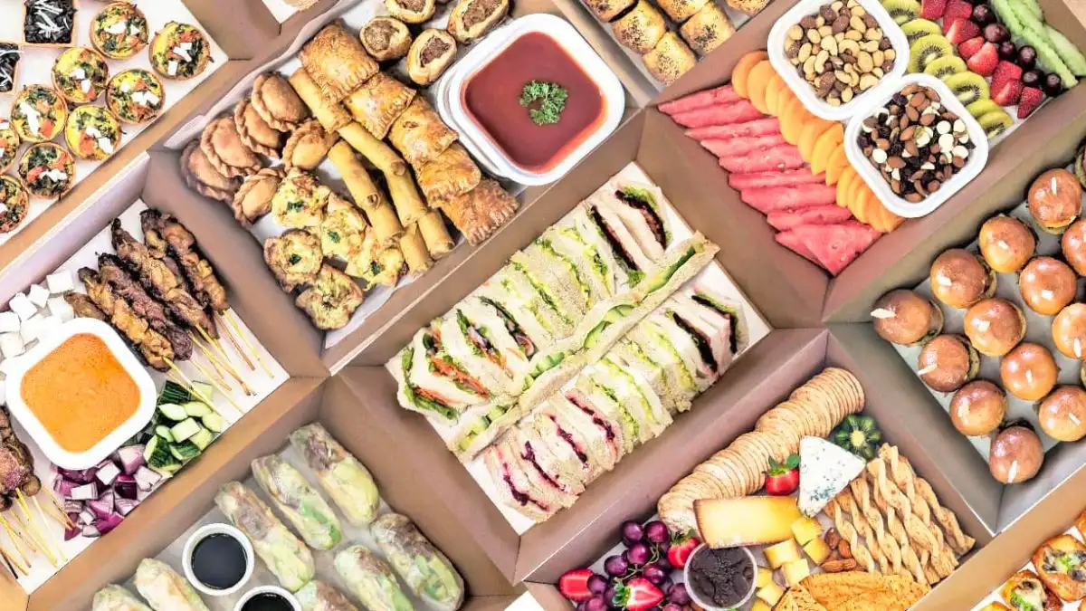 Platters of sandwiches, hot finger foods and fruit from Sevenoaks Catering.
