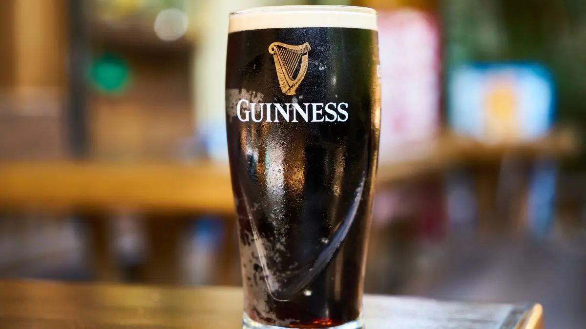 Pint of Guinness on a bar.