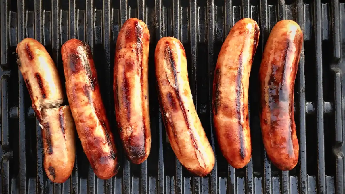 Sausages on a grill.