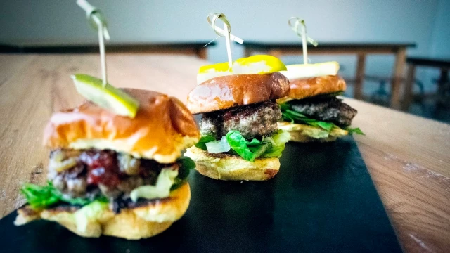 Black plate with three sliders.