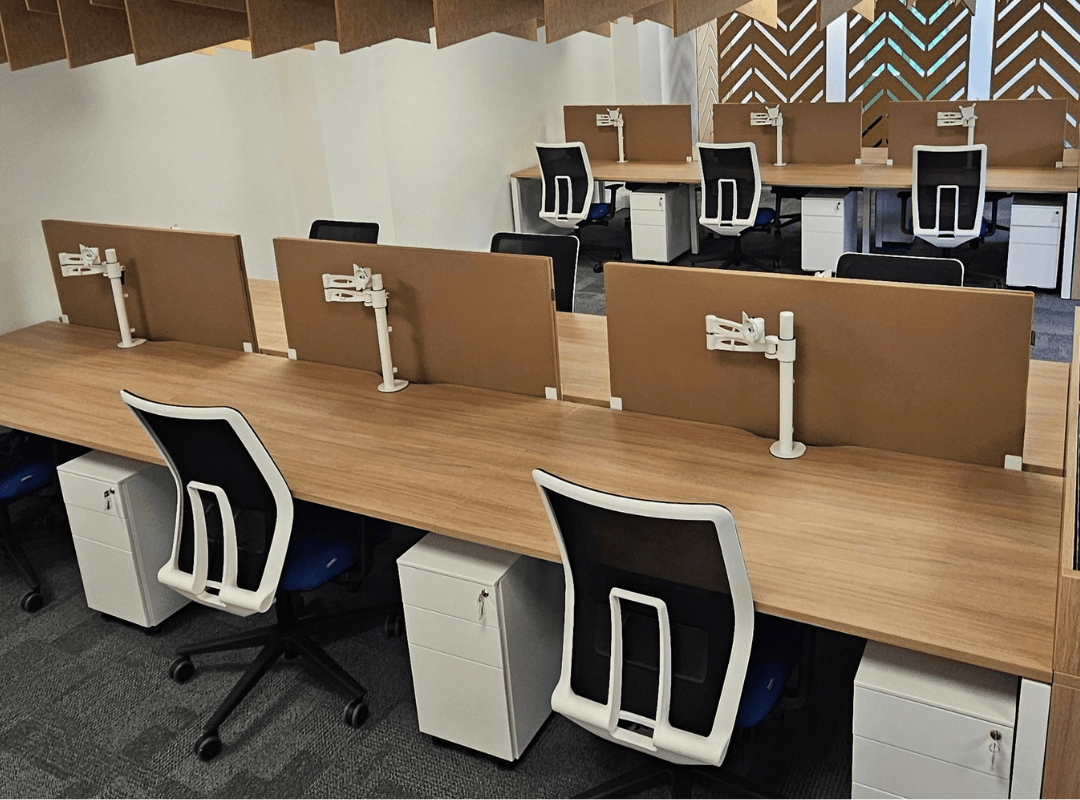 6 Person bench desk in open plan office with urban oak top and white frame