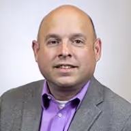 A person in a suitAI-generated content may be incorrect.