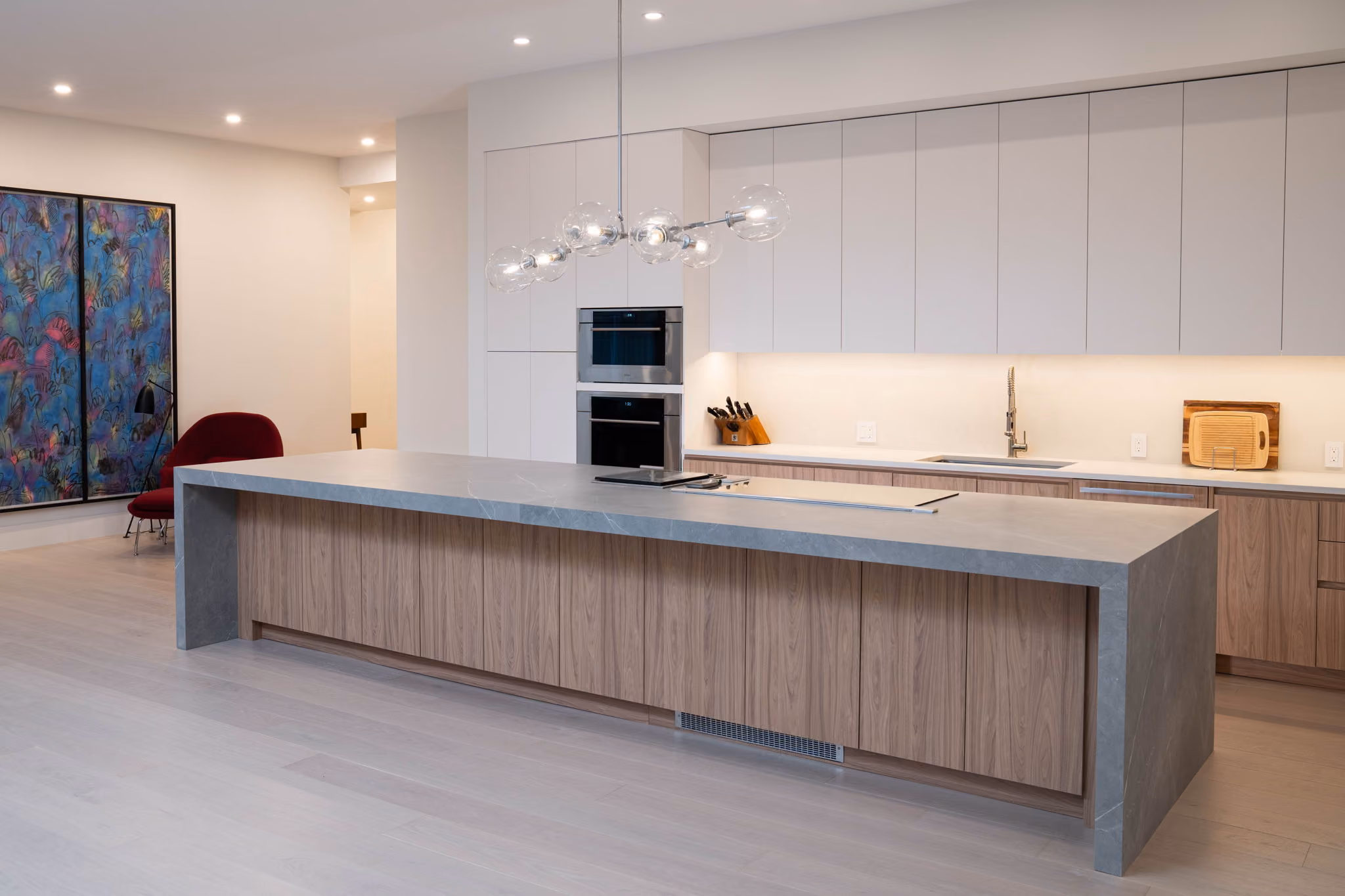Wide-plank wood flooring in a kitchen from a Manhattan condo renovation at 252 Seventh Avenue, by Gallery KBNY