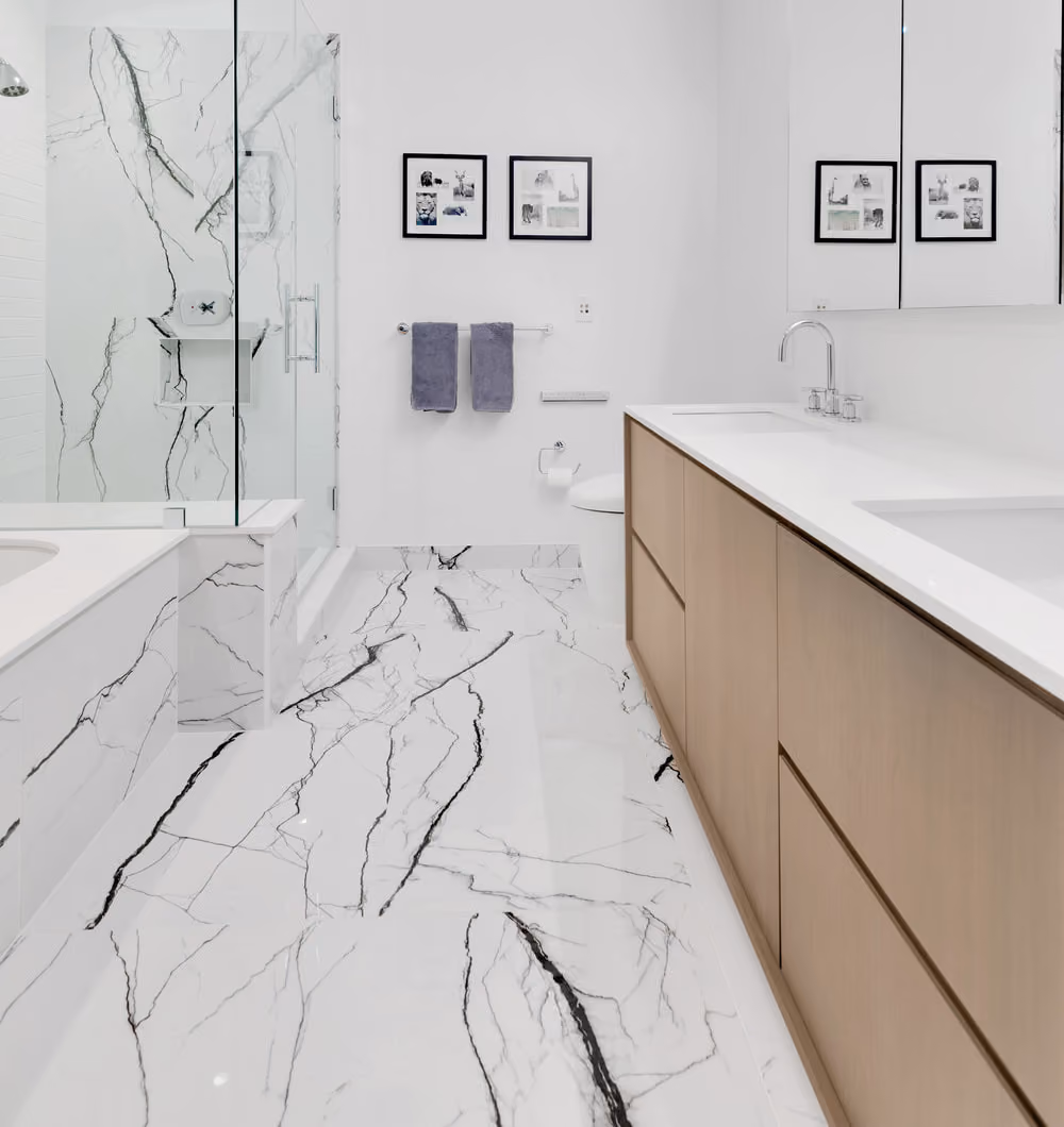 Marble-look porcelain tile flooring in a bathroom from a DUMBO loft renovation, Brooklyn, by Gallery KBNY