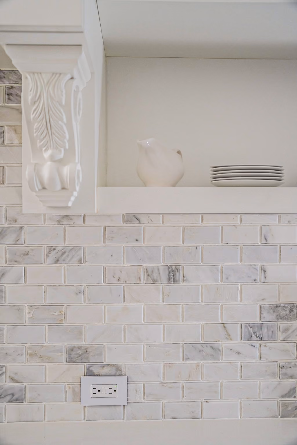 Asian Statuary beveled marble mosaic backsplash in a boutique co-op renovation at 230 East 50th Street in Manhattan by Gallery KBNY