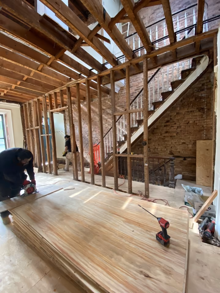 Interior framing against exposed brick during a Carroll Gardens brownstone renovation at 347 President Street, Brooklyn, by Gallery KBNY