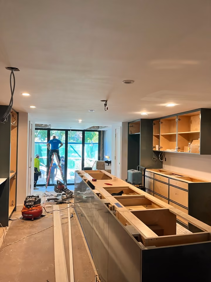 Kitchen cabinetry installation during a Carroll Gardens brownstone renovation at 347 President Street, Brooklyn, by Gallery KBNY