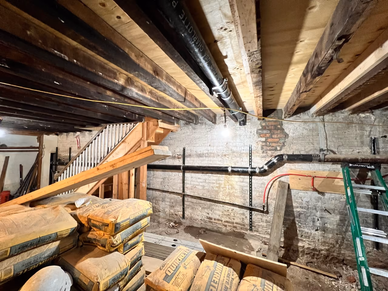Exposed structural joists during a gut renovation of a Carroll Gardens brownstone at 347 President Street, Brooklyn, by Gallery KBNY