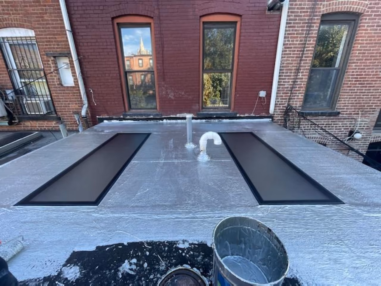 Restored rear facade and new patio at a Carroll Gardens brownstone at 347 President Street, Brooklyn, by Gallery KBNY