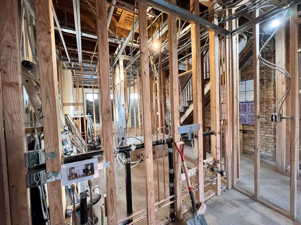 Rough mechanical and framing work during a Carroll Gardens brownstone renovation at 347 President Street, Brooklyn, by Gallery KBNY