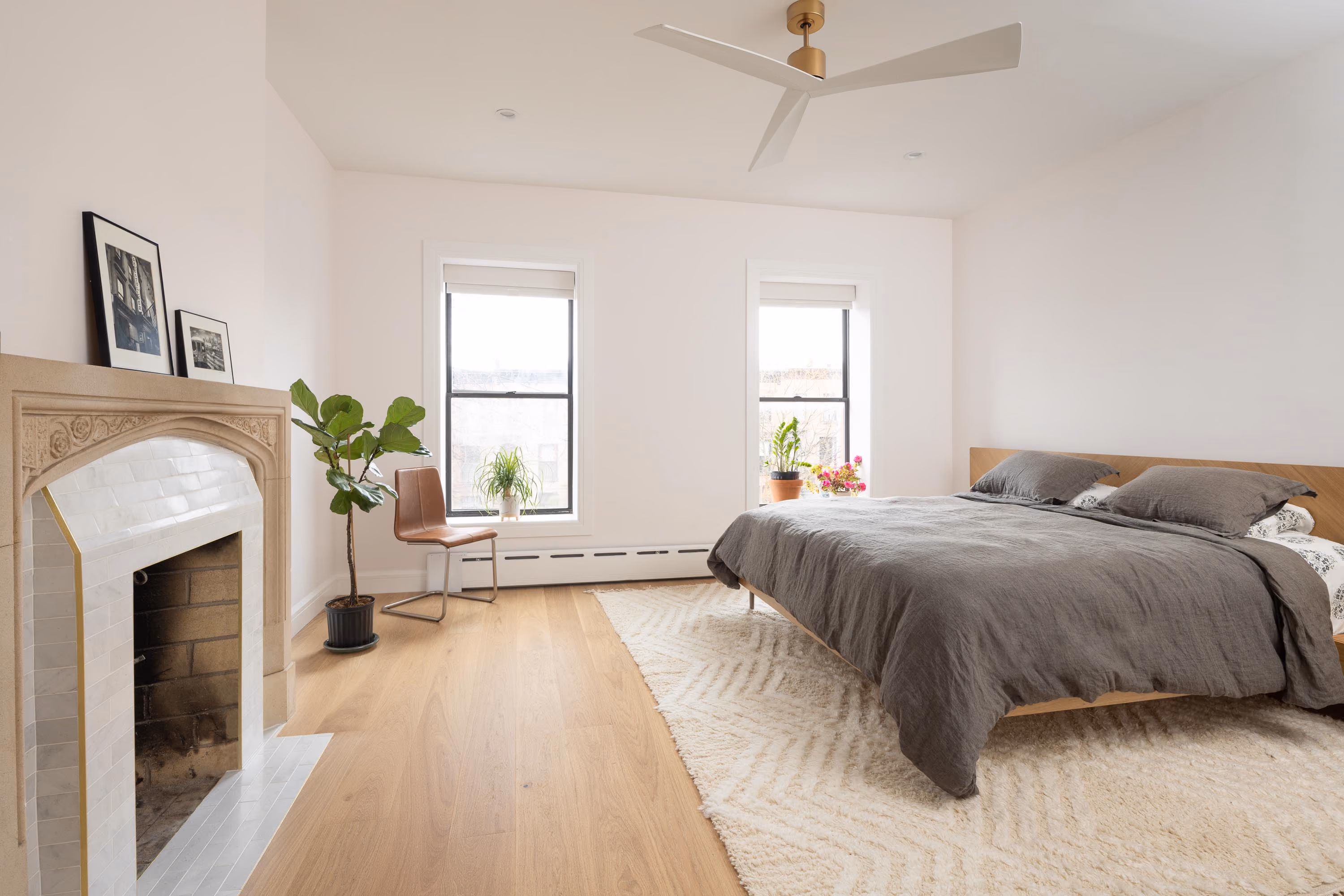 Renovated bedroom with restored fireplace in a Carroll Gardens brownstone at 347 President Street, Brooklyn, by Gallery KBNY