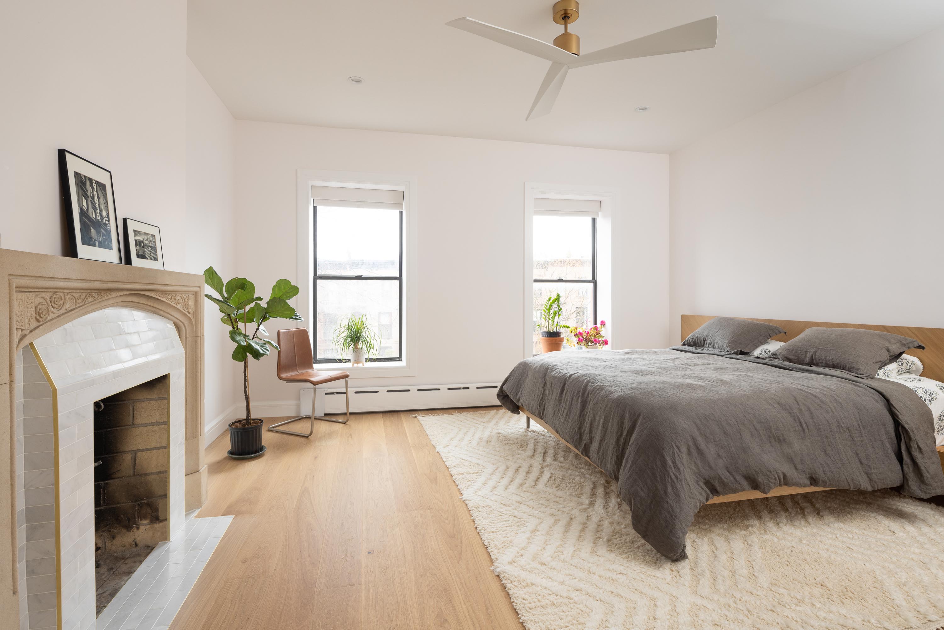 Renovated bedroom with restored fireplace in a Carroll Gardens brownstone at 347 President Street, Brooklyn, by Gallery KBNY