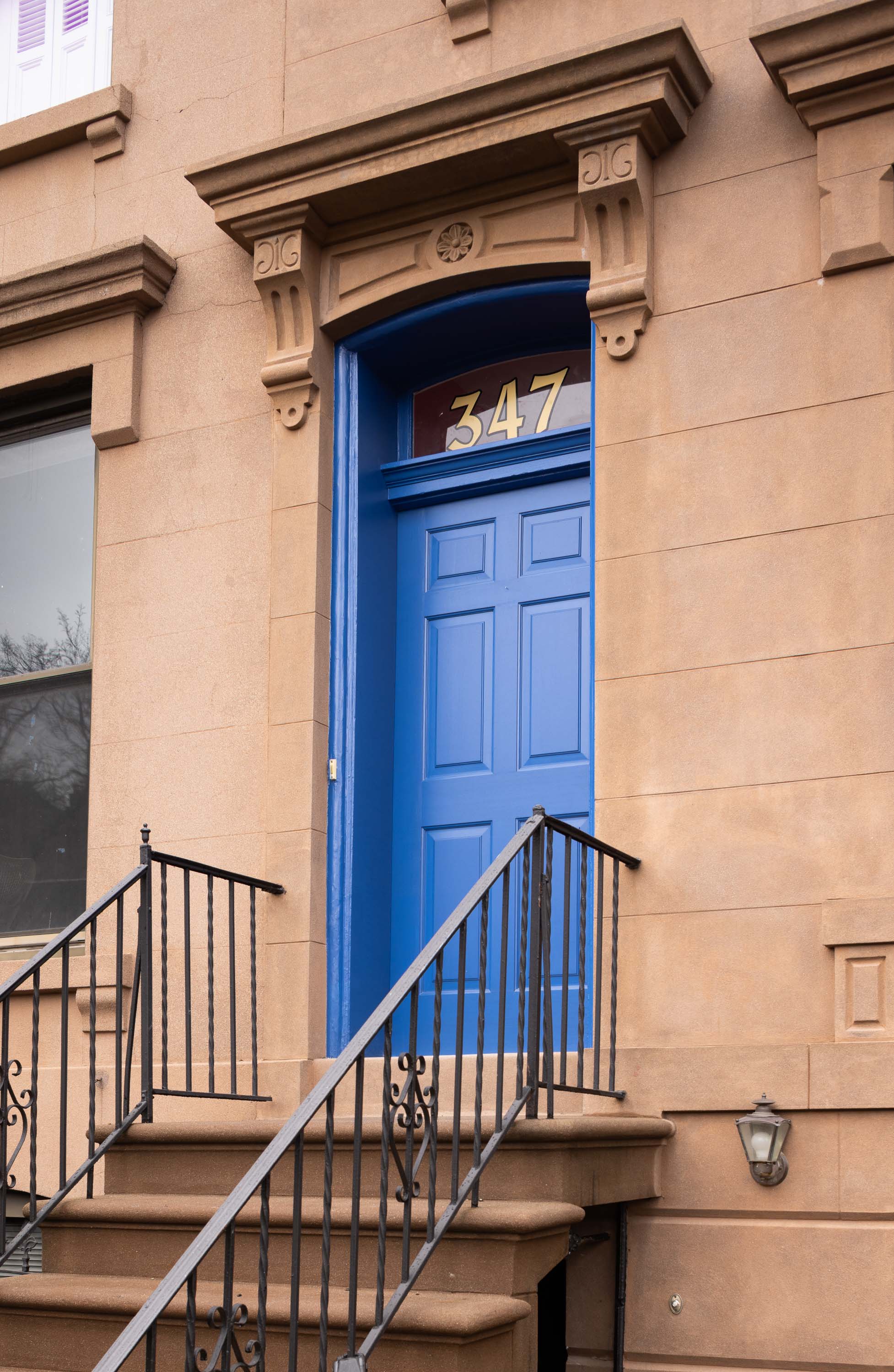 Restored brownstone facade with custom blue door at 347 President Street in Carroll Gardens, Brooklyn, by Gallery KBNY