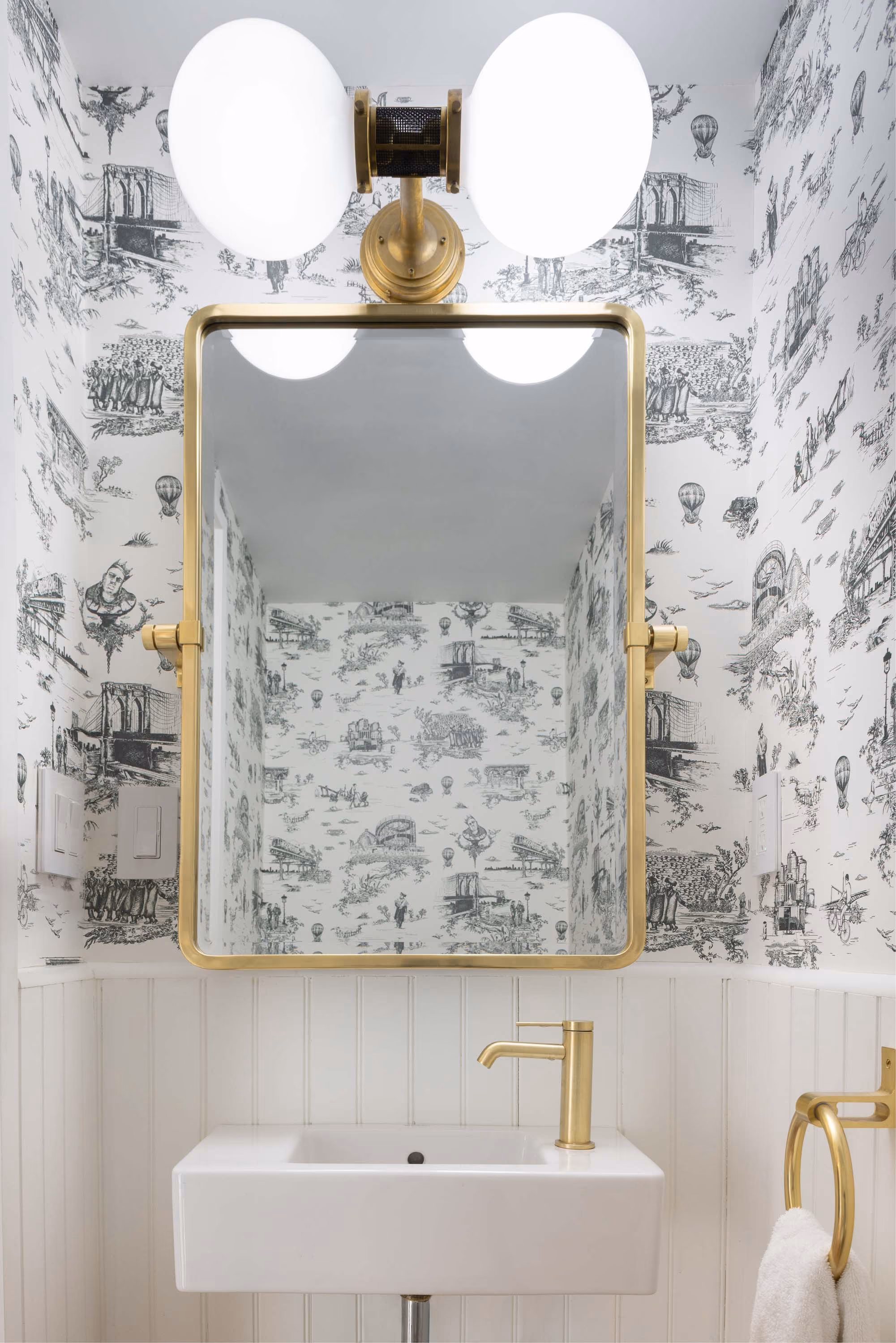 Powder room with toile wallpaper in a Carroll Gardens brownstone at 347 President Street, Brooklyn, by Gallery KBNY