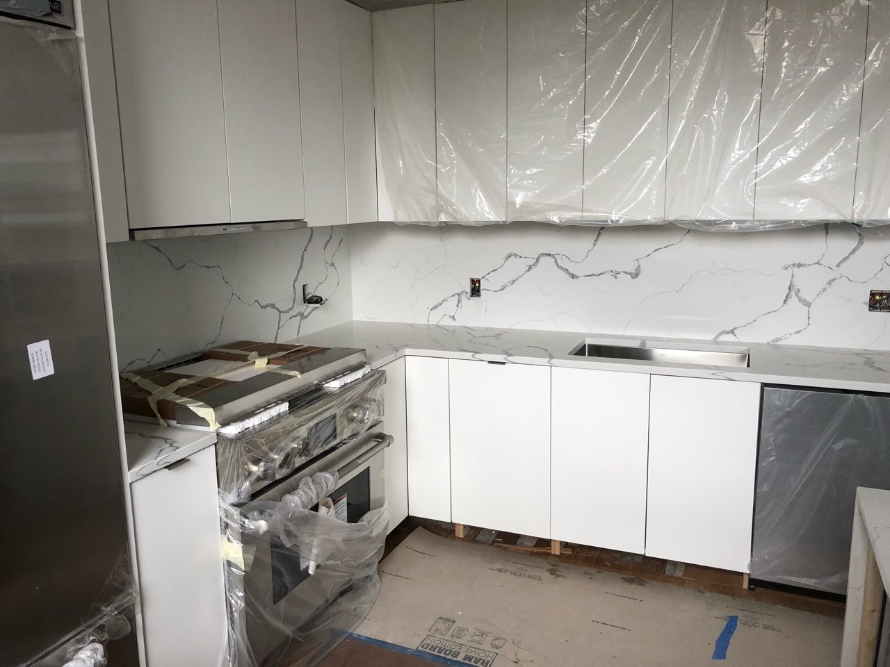 Construction in progress during a loft kitchen renovation at BellTel Lofts at 365 Bridge Street in Downtown Brooklyn, by Gallery KBNY (view 5)