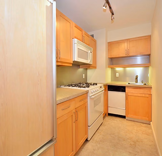 Interior before a post-war co-op kitchen renovation at The Norville House at 13 West 13th Street in Greenwich Village, Manhattan, by Gallery KBNY