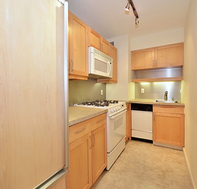Interior before a post-war co-op kitchen renovation at The Norville House at 13 West 13th Street in Greenwich Village, Manhattan, by Gallery KBNY