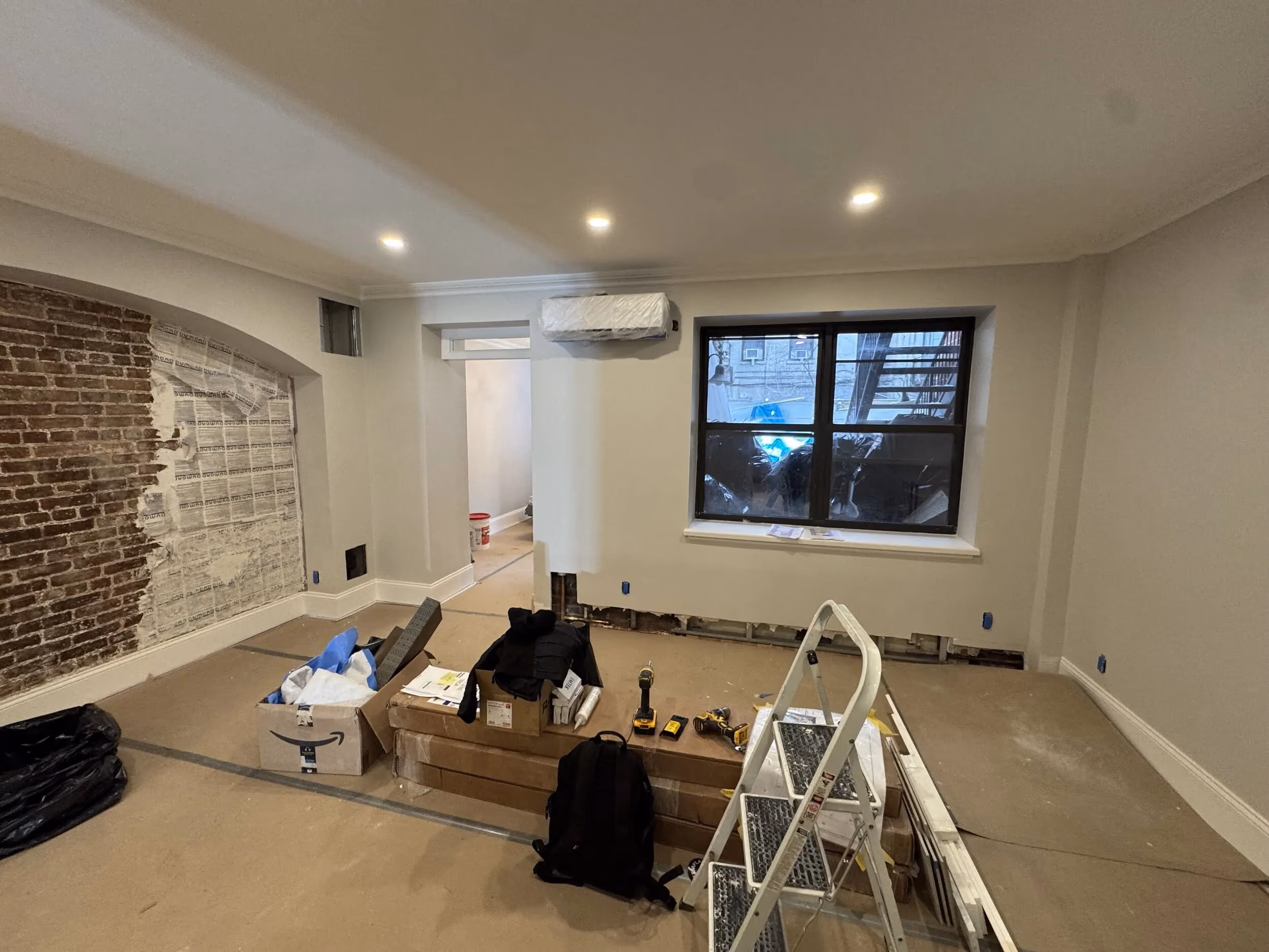 Wall-mounted HVAC unit and brick repair during a full gut renovation at 119 West 82nd Street on the Upper West Side, Manhattan, by Gallery KBNY