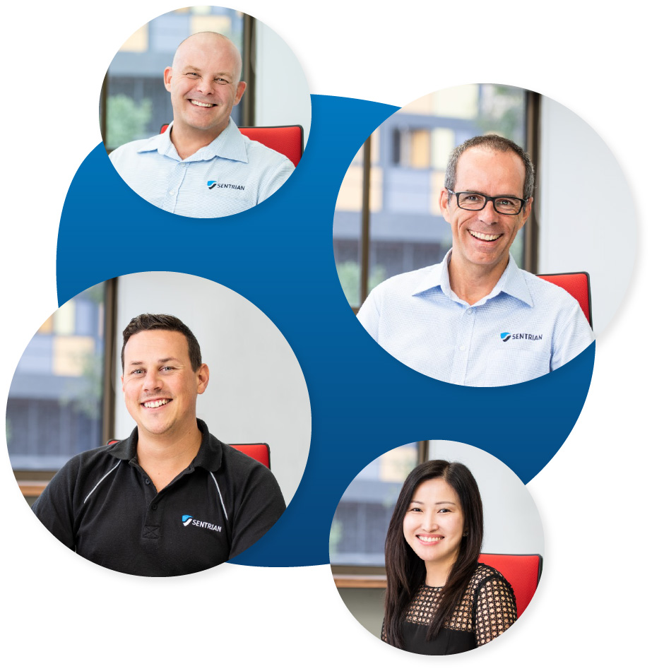 4 smiling Sentrian team members
