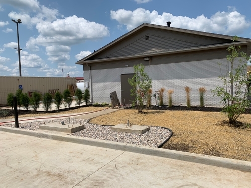 Professional landscape installation with vibrant plants and mulch in Uniontown, OH