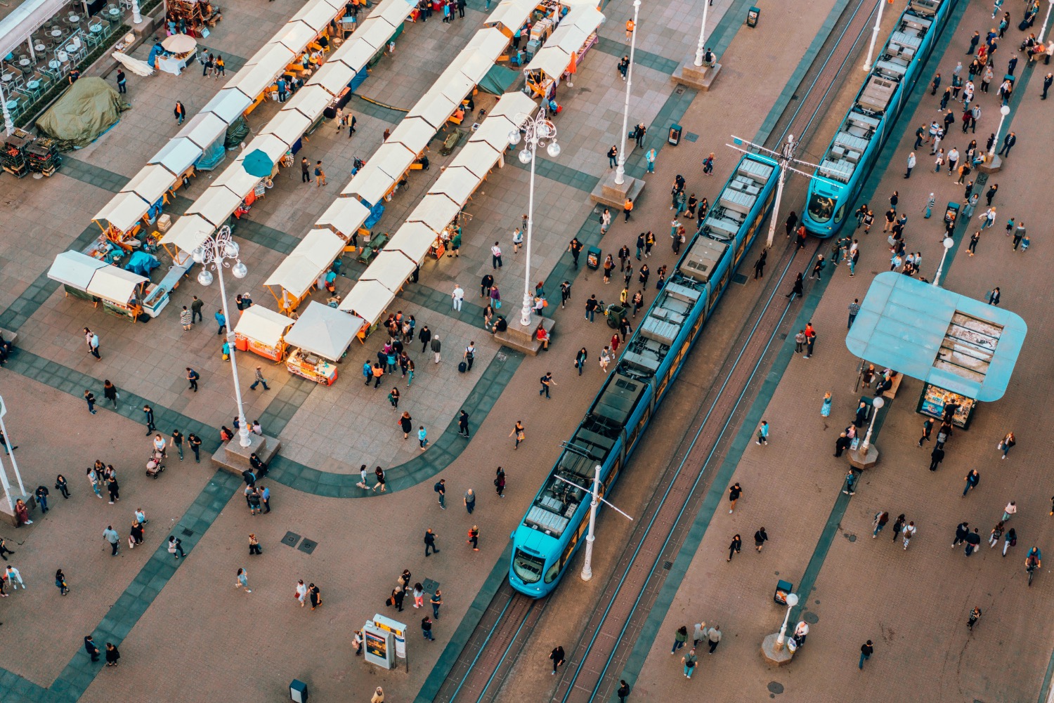 Overhead image of train station full of people