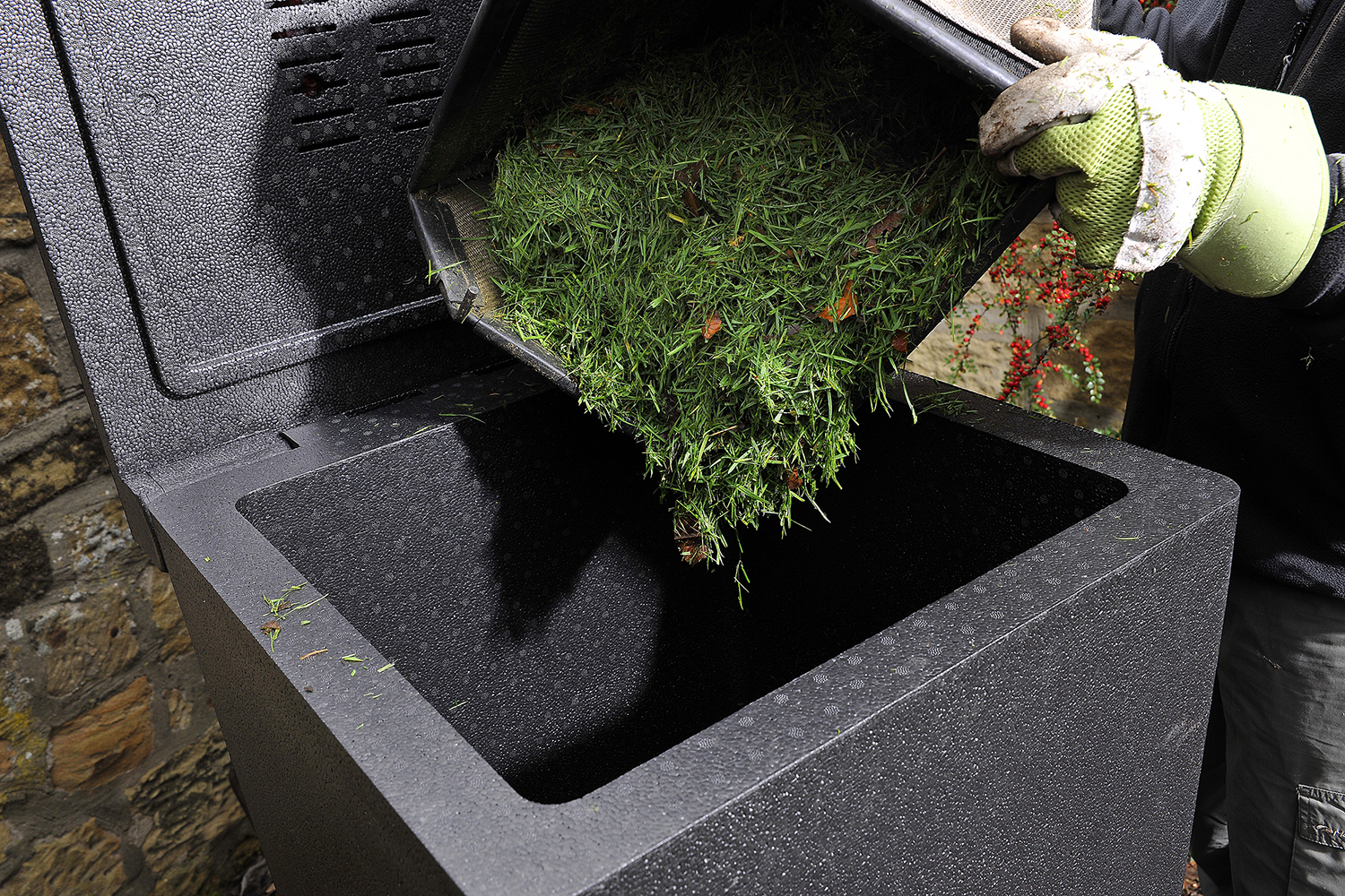 Adding fresh grass clippings to a HOTBIN hot composter