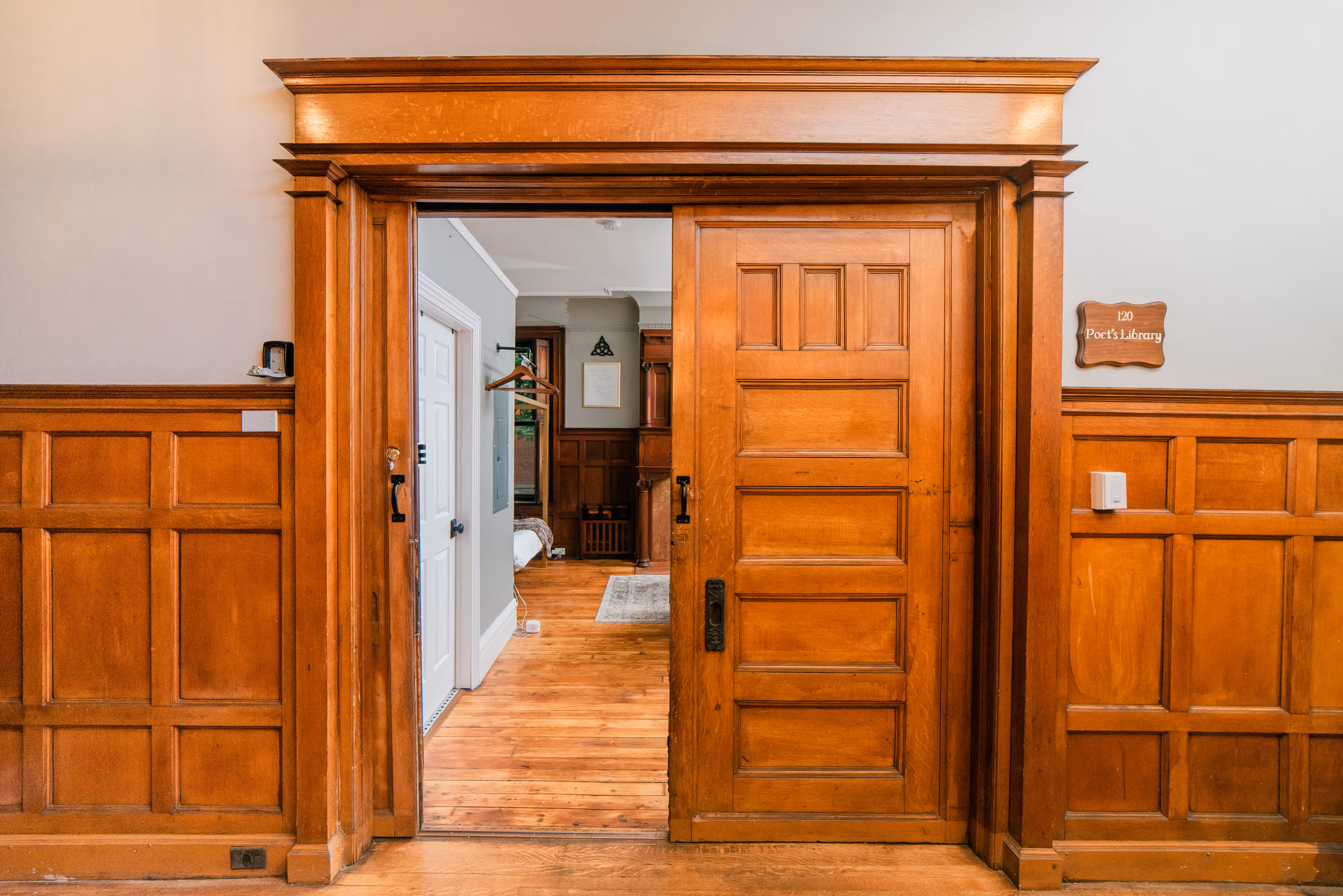 View through sliding door into a renovated an furnished apartment at the Hamilton