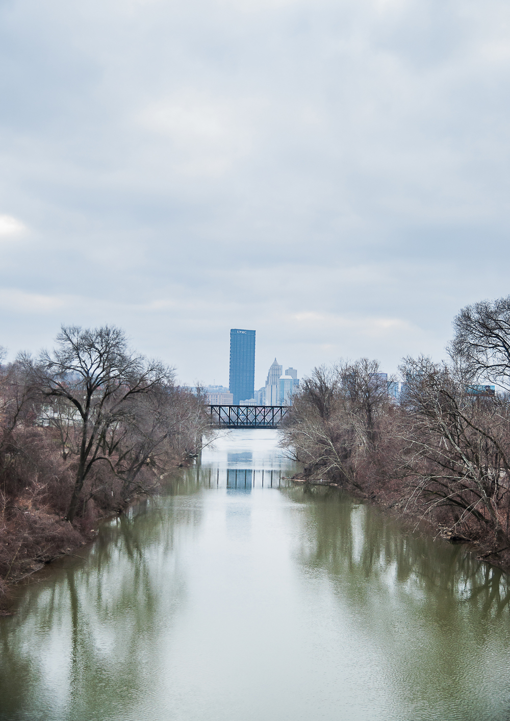 Photo of river leading up to the downtown Pittsburgh skyline